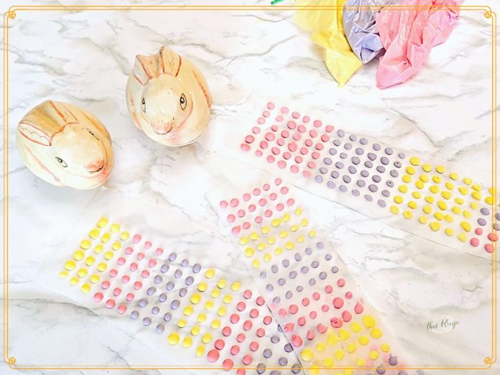 candy buttons (candy dots) with decorative rabbits on a marble background