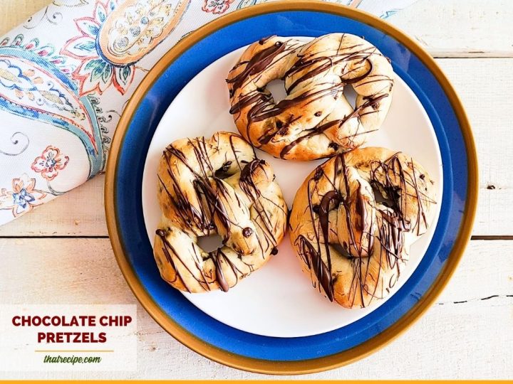 chocolate drizzled chocolate chip pretzels on a plate