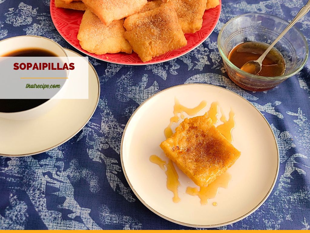 sopaipillas on a plate with cinnamon sugar and honey