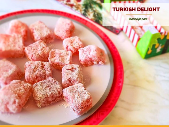 pink candies coated in powdered sugar on a plate with text "Turkish Delight"