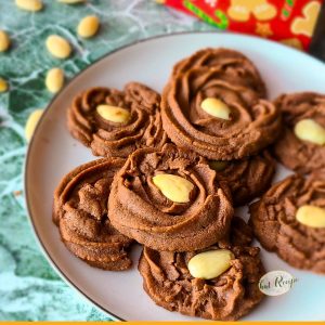 chocolate swirl cookies topped with almonds with text "mocha Viennese swirls"