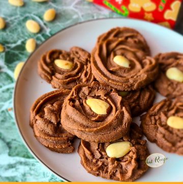 chocolate swirl cookies topped with almonds with text "mocha Viennese swirls"