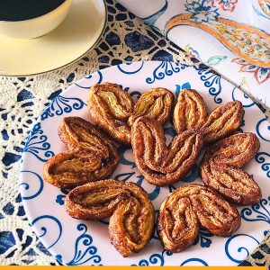 palmiers on a plate with text "cinnamon sugar palmiers"