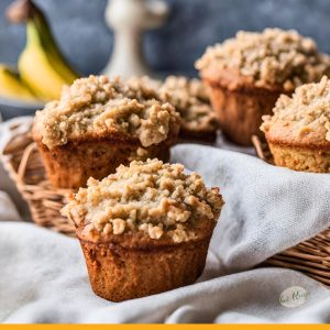 banana nut muffins with streusel topping on a table
