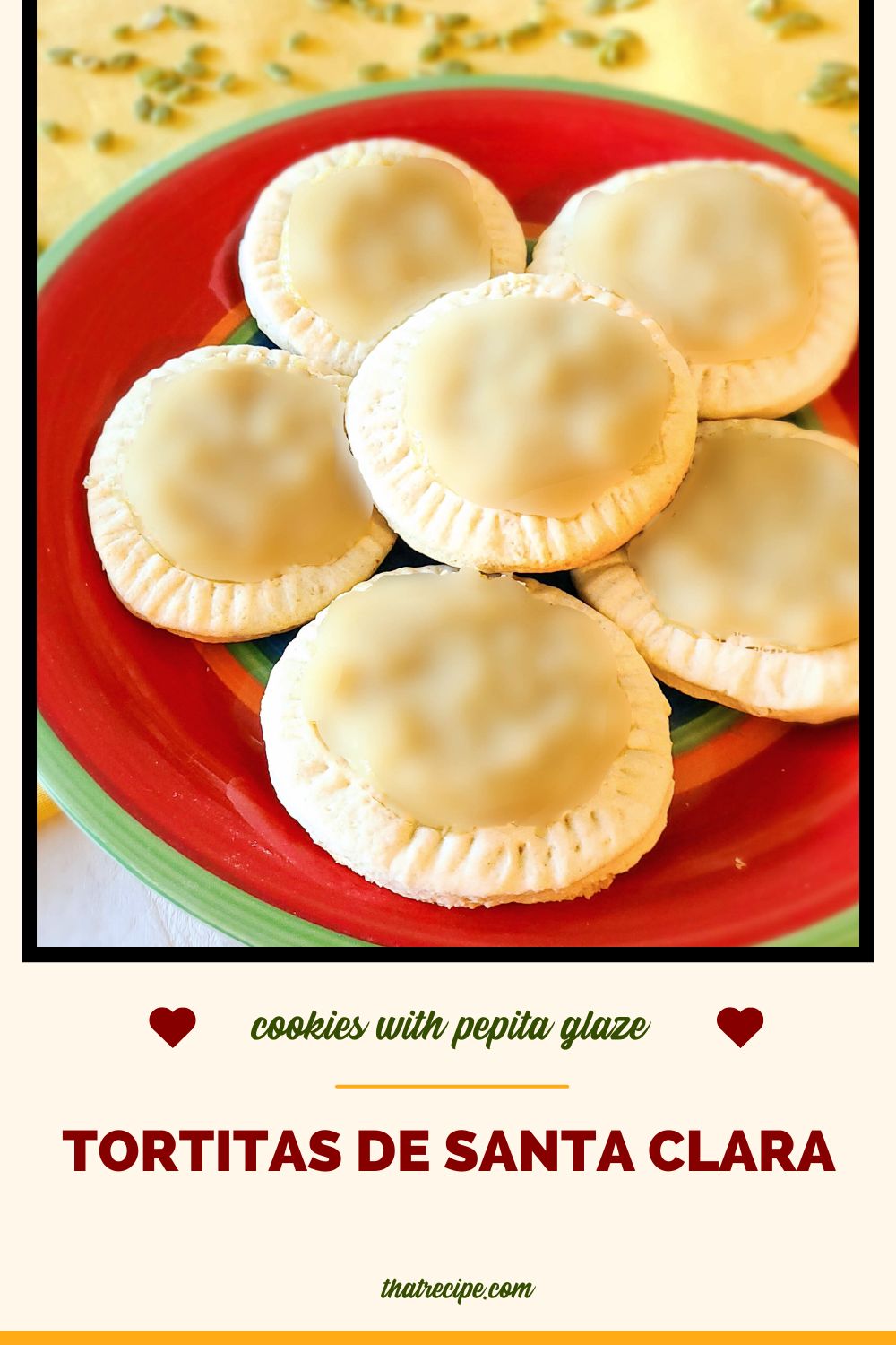 Cookies with a light green glaze on a plate with text overlay Tortitas de Santa Clara