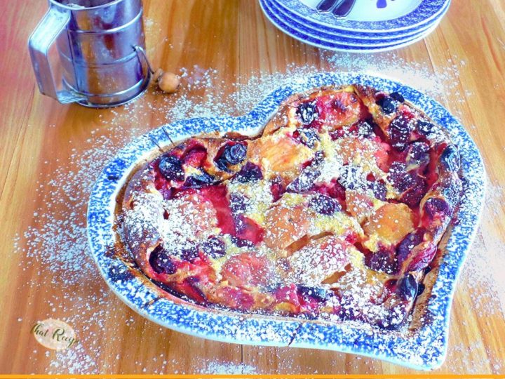 clafoutis topped with peaches, plums and cherries