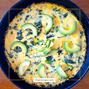 top down view of shrimp spinach frittata topped with avocado