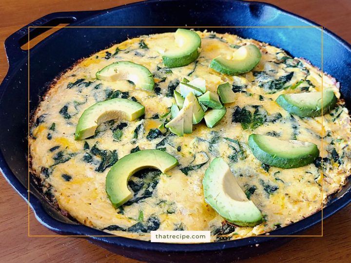 top down view of shrimp spinach frittata topped with avocado