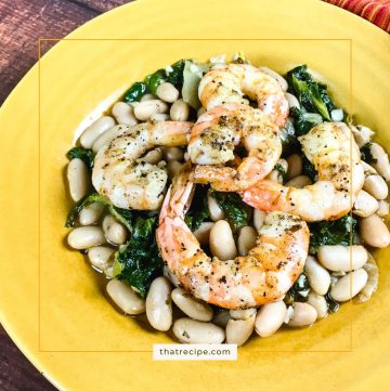 shrimp and white beans on a plate