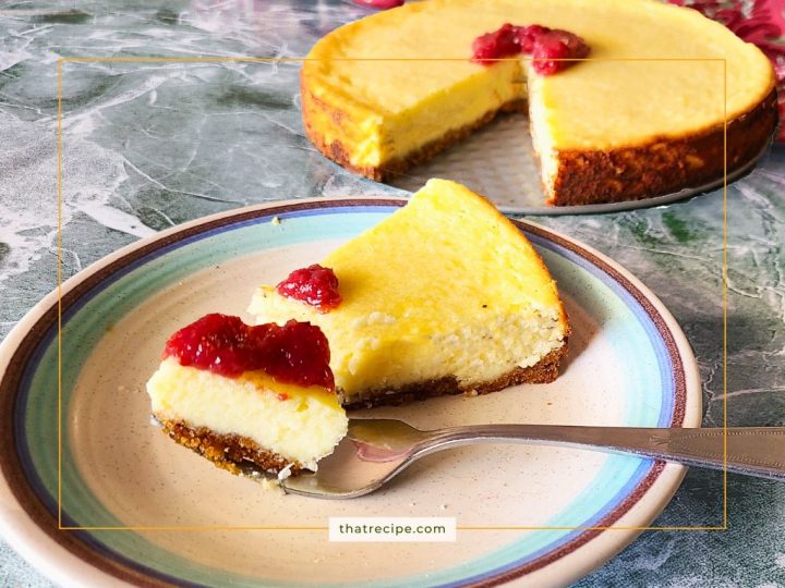 almond ricotta pie topped with strawberry sauce