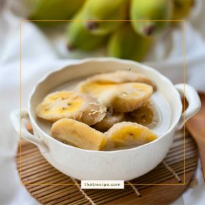 bowl of sliced bananas in coconut milk