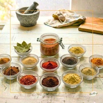 spices in bowls and jars on a table