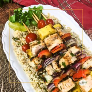 pineapple and swordfish skewers on bed of rice