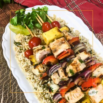 pineapple and swordfish skewers on bed of rice