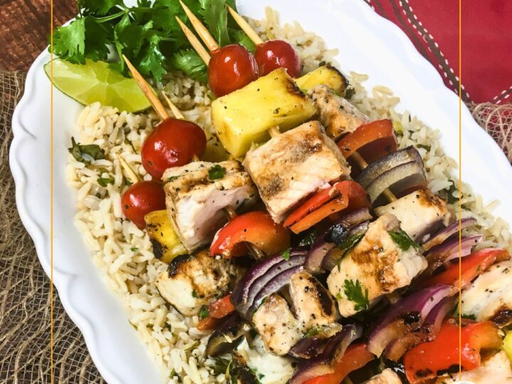 pineapple and swordfish skewers on bed of rice