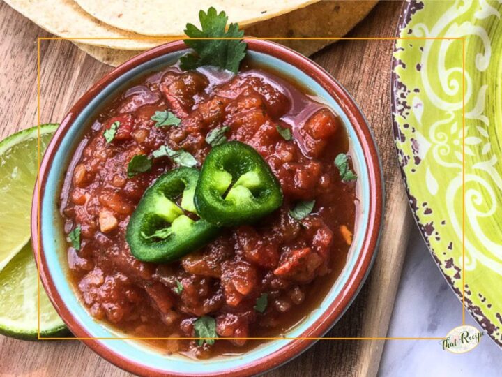 bowl of salsa topped with jalapeno slices